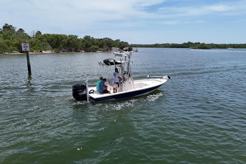 Slide: The Image of 2006 Pathfinder 2200 Tournament Edition boat cruising on a calm lake. - 4
