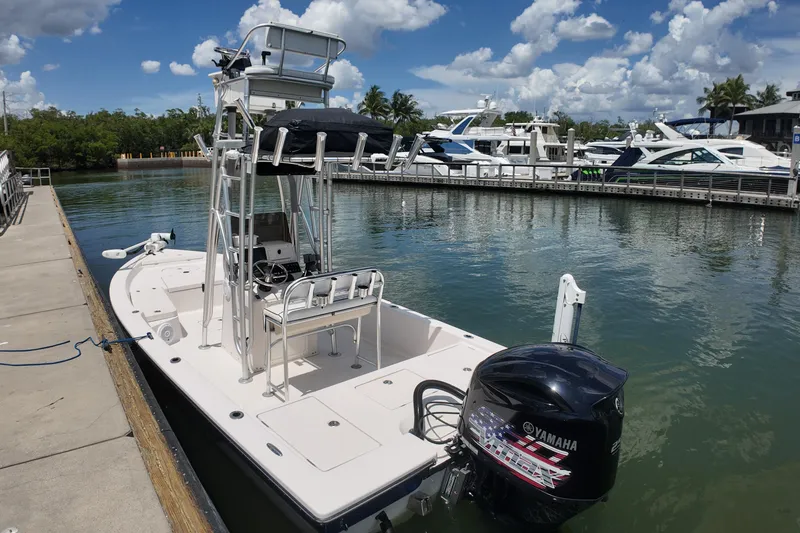 Slide: The Image of 2006 Pathfinder 2200 Tournament Edition boat docked, featuring Yamaha outboard motor, under a sunny sky. - 6