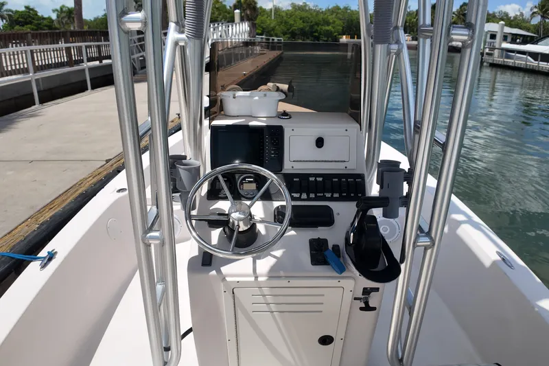 Slide: The Image of 2006 Pathfinder 2200 Tournament Edition boat console with steering wheel and controls. - 8