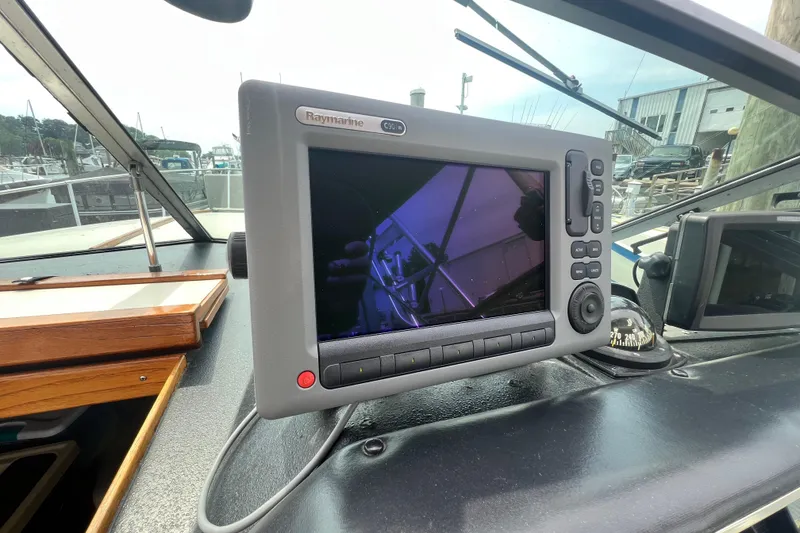 Slide: The Image of Raymarine C90W navigation system on 1986 Sea Ray 270 Amberjack boat dashboard. - 18
