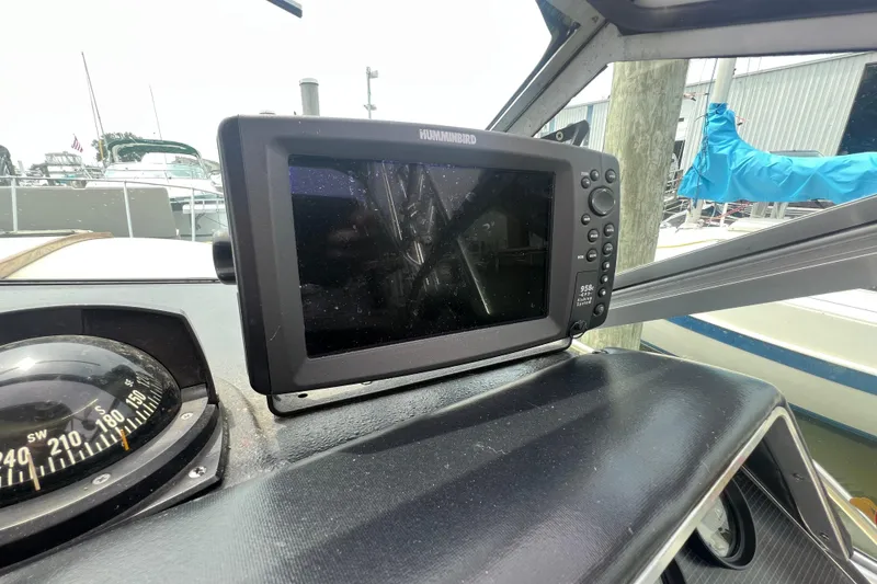 Slide: The Image of Dashboard of a 1986 Sea Ray 270 Amberjack with Humminbird fishfinder and compass. - 19