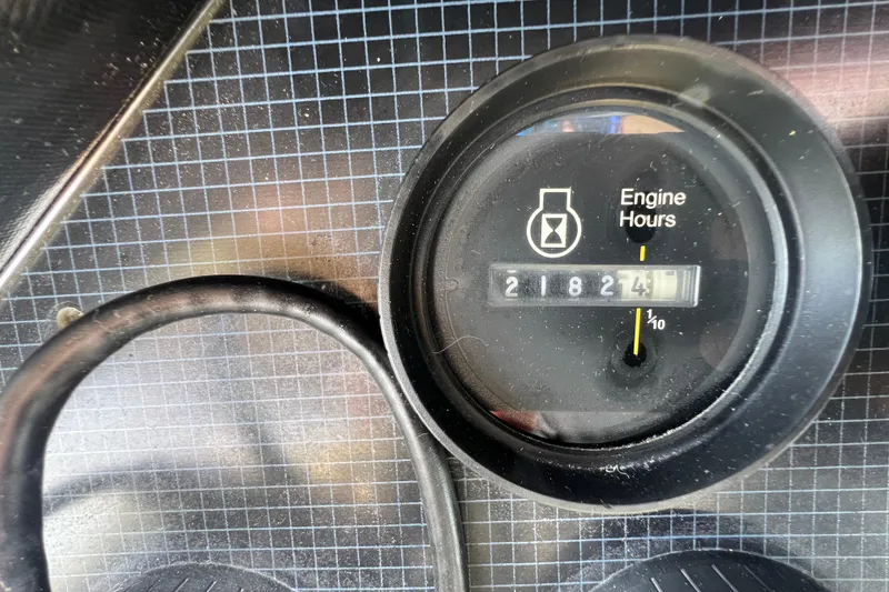 Slide: The Image of Engine hour meter showing 2182.4 hours on 1986 Sea Ray 270 Amberjack. - 21