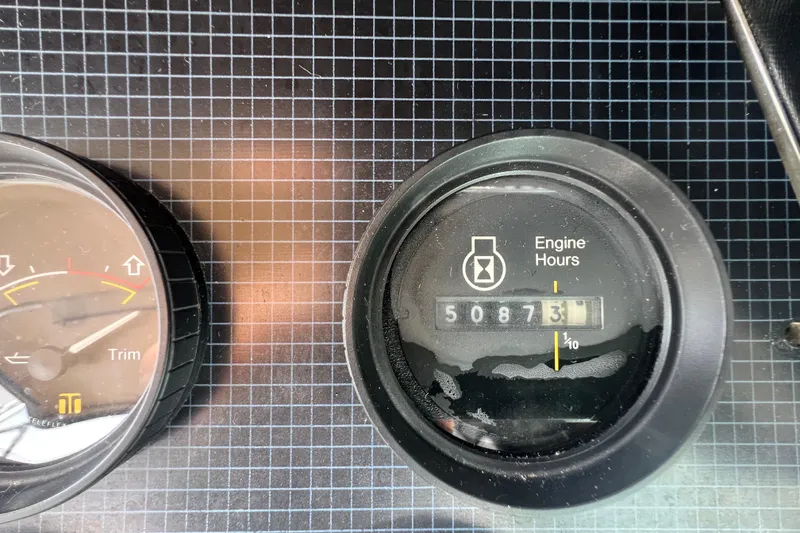 Slide: The Image of 1986 Sea Ray 270 Amberjack engine hours gauge showing 5087.3 hours. - 22
