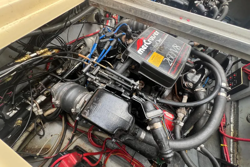 Slide: The Image of Engine compartment of a 1986 Sea Ray 270 Amberjack with MerCruiser Alpha One 260 V8 engine. - 26