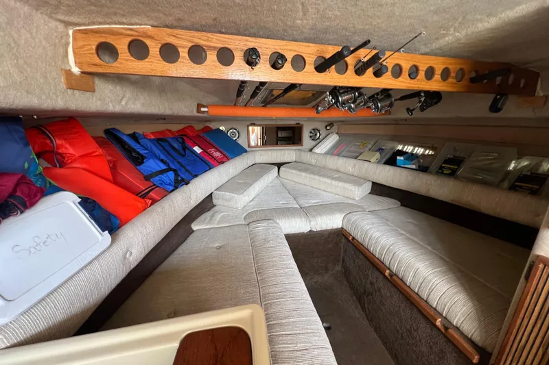 Slide: The Image of Interior of 1986 Sea Ray 270 Amberjack boat with fishing rods and life jackets. - 29