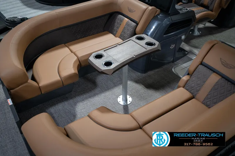 Slide: The Image of Luxurious interior of 2026 Bennington 22 MFB pontoon boat with plush seating and table. - 12