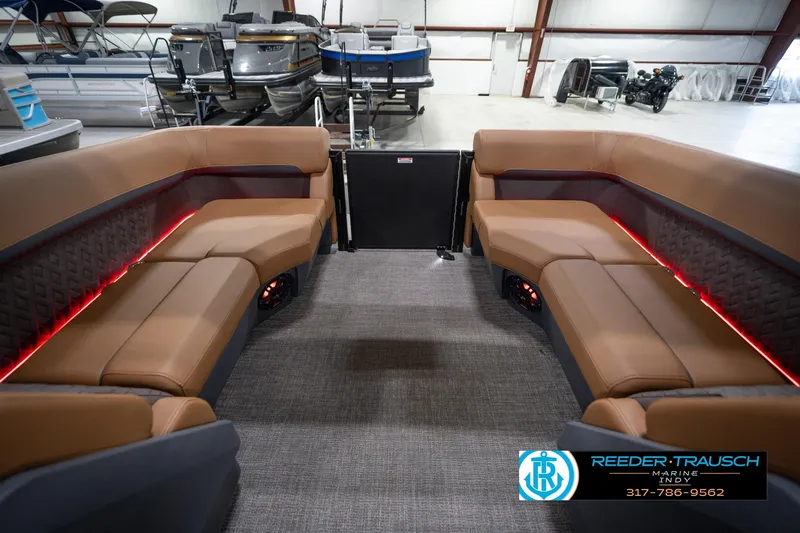 Slide: The Image of 2026 Bennington 22 MFB pontoon boat interior with luxurious seating and ambient lighting. - 17