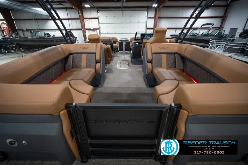 Slide: The Image of Luxurious interior of 2026 Bennington 22 MFB pontoon boat with tan seating. - 18