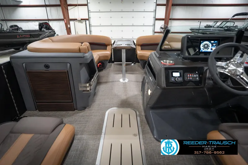 Slide: The Image of Interior of 2026 Bennington 22 MFB pontoon boat with luxurious seating and modern dashboard. - 19