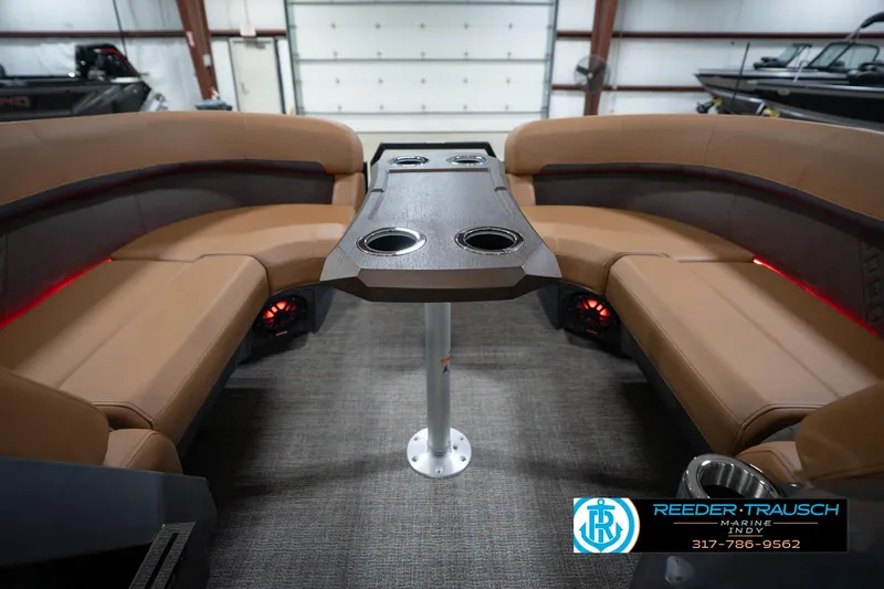 Slide: The Image of Luxurious interior of 2026 Bennington 22 MFB boat with plush seating and cup holders. - 20