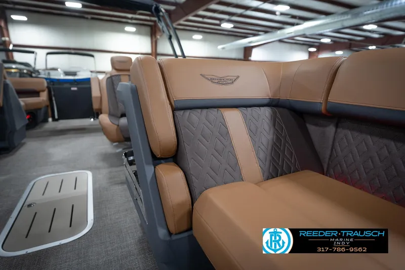 Slide: The Image of Luxurious interior of 2026 Bennington 22 MFB boat with tan and gray seating. - 23