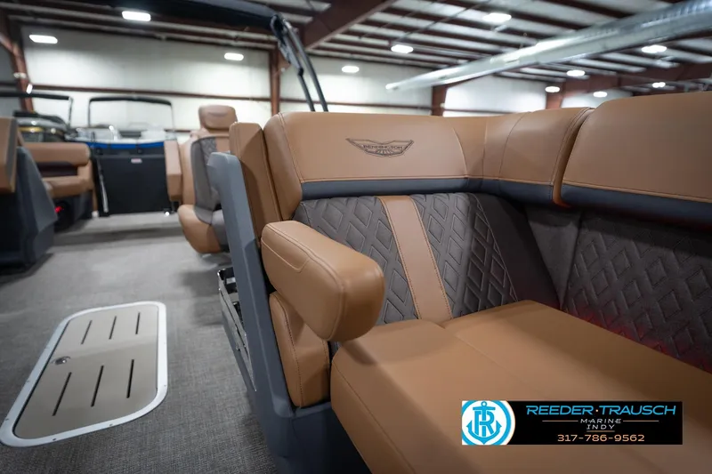 Slide: The Image of 2026 Bennington 22 MFB boat interior with luxurious tan seating and modern design. - 24