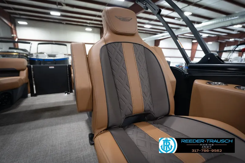 Slide: The Image of 2026 Bennington 22 MFB boat interior with luxurious tan and gray seating. - 27