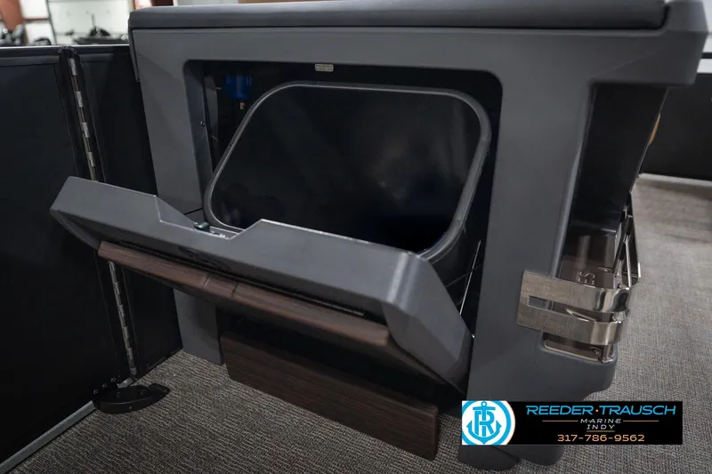 Slide: The Image of 2026 Bennington 22 MFB boat storage compartment with open lid, showcasing interior space. - 30