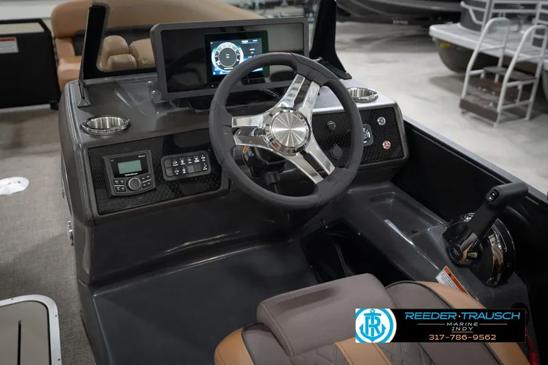 Slide: The Image of 2026 Bennington 22 MFB boat dashboard with steering wheel and control panel. - 33