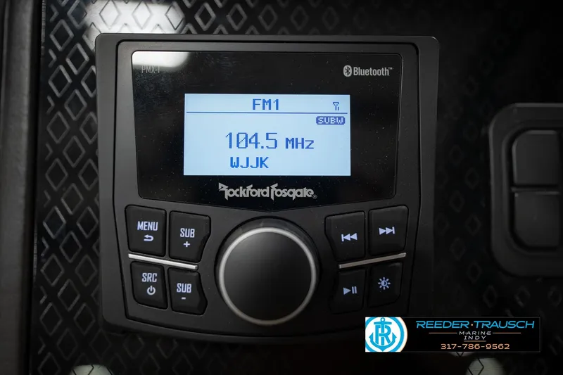 Slide: The Image of Rockford Fosgate stereo system in 2026 Bennington 22 MFB, displaying FM radio station 104.5 MHz. - 35