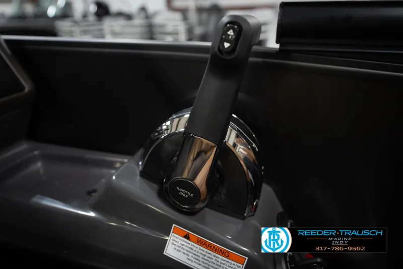 Slide: The Image of Throttle control of 2026 Bennington 22 MFB boat, featuring sleek design and warning label. - 38