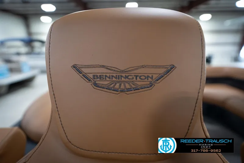 Slide: The Image of 2026 Bennington 22 MFB boat seat with logo in showroom setting. - 42