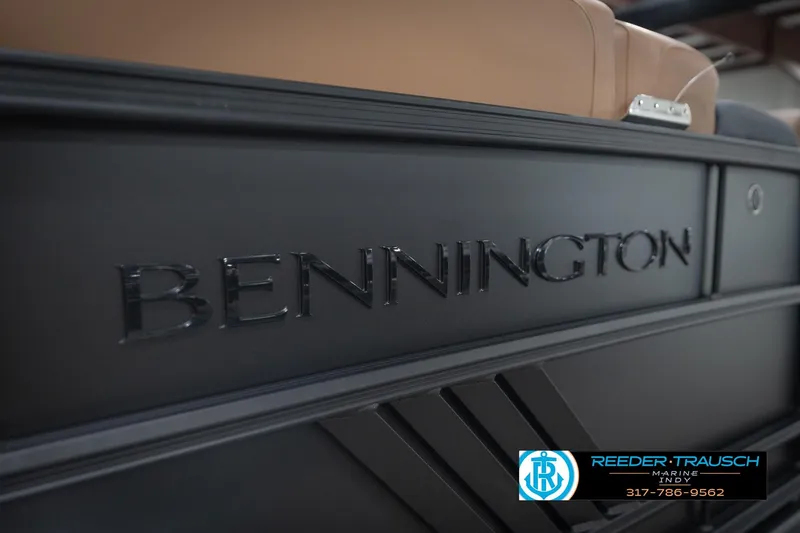 Slide: The Image of 2026 Bennington 22 MFB boat with sleek black exterior and logo detail. - 50