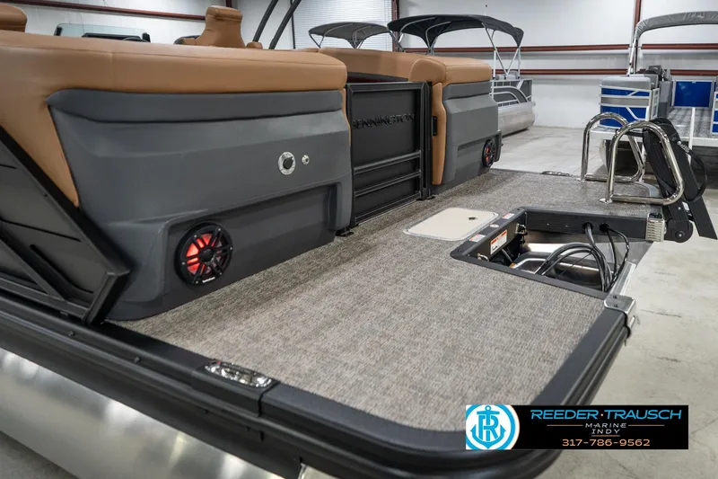 Slide: The Image of 2026 Bennington 22 MFB pontoon boat interior with tan seating and modern features. - 52