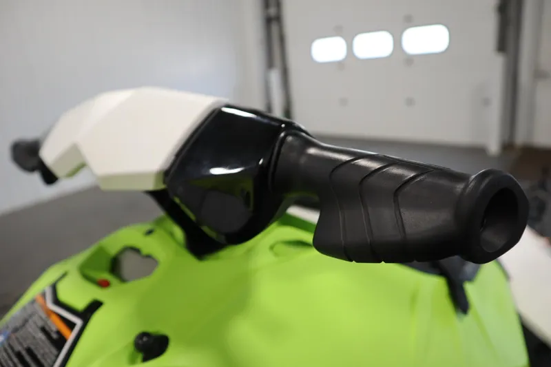 Slide: The Image of Close-up of 2023 Sea-Doo SPARK 3 IBR CONV SS handlebar in a garage setting. - 13
