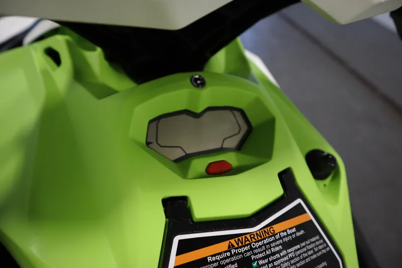 Slide: The Image of 2023 Sea-Doo SPARK 3 IBR dashboard with warning label, green color. - 14