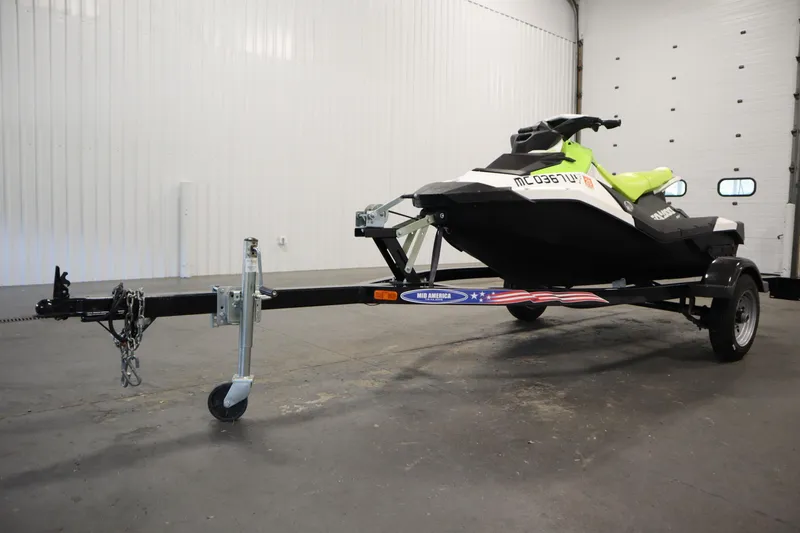 Slide: The Image of 2023 Sea-Doo SPARK 3 IBR CONV SS on trailer in a garage. - 24