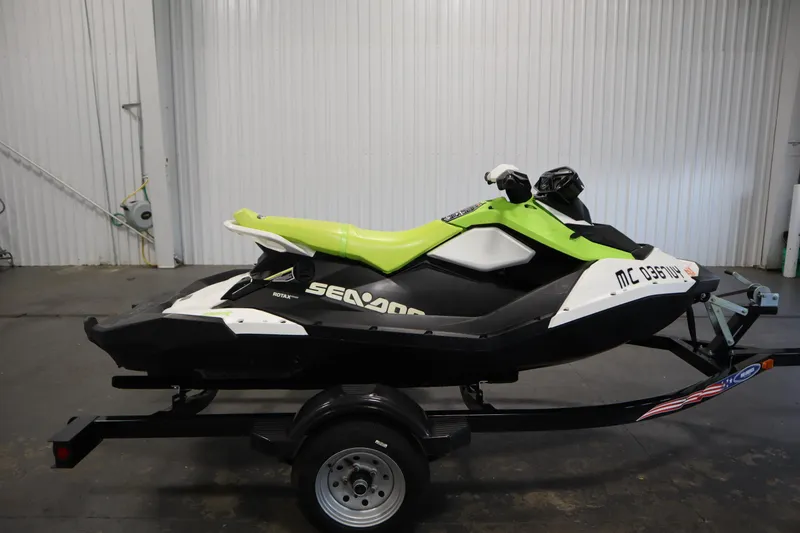 Slide: The Image of 2023 Sea-Doo SPARK 3 IBR CONV SS jet ski on trailer in garage. - 33
