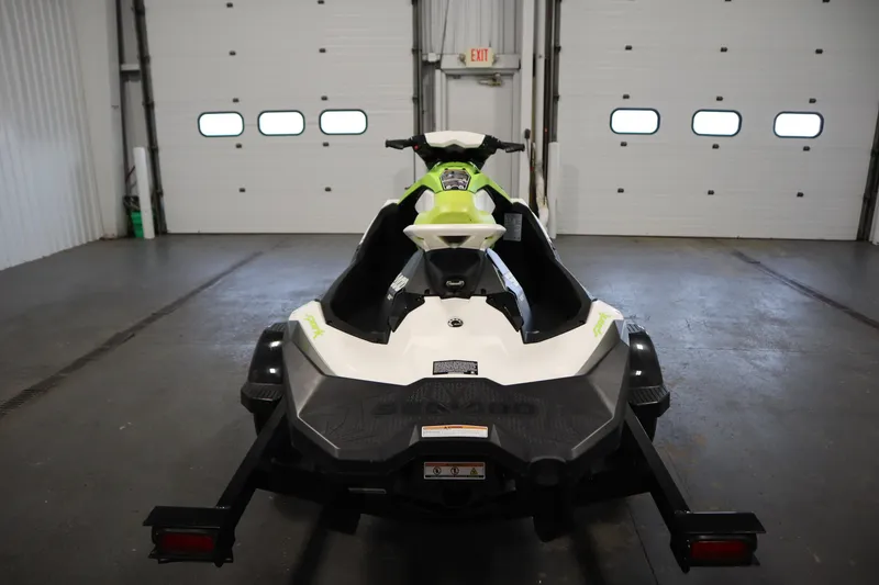 Slide: The Image of 2023 Sea-Doo SPARK 3 IBR CONV SS jet ski in a garage setting. - 35