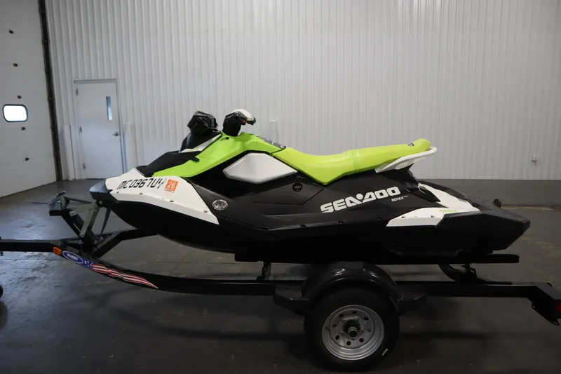 Slide: The Image of 2023 Sea-Doo SPARK 3 IBR CONV SS jet ski on trailer in garage. - 37