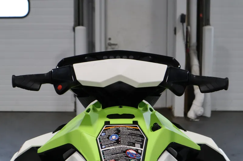 Slide: The Image of 2023 Sea-Doo SPARK 3 IBR CONV SS handlebars in a garage setting. - 38
