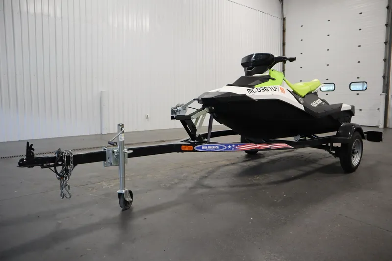 Slide: The Image of 2023 Sea-Doo SPARK 3 IBR CONV SS on trailer in garage setting. - 43