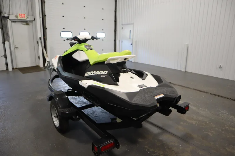 Slide: The Image of 2023 Sea-Doo SPARK 3 IBR CONV SS on trailer in indoor garage. - 7