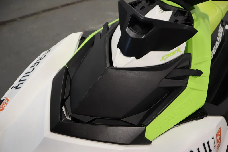 Slide: The Image of 2023 Sea-Doo SPARK 3 IBR CONV SS, close-up of sleek black and green design. - 9