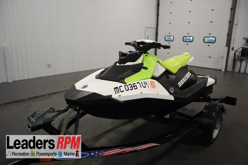 The Image of 2023 Sea-Doo SPARK 3 IBR CONV SS jet ski on trailer in showroom. - 1