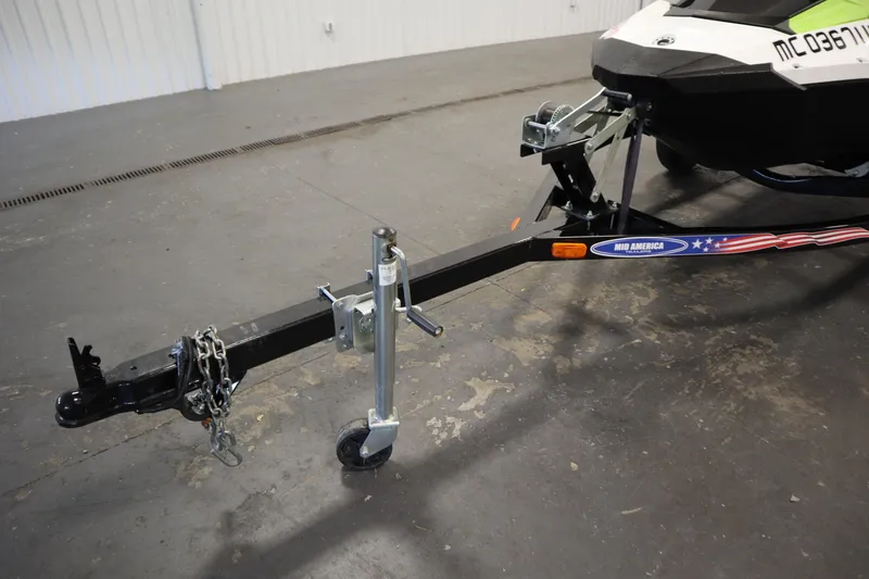 Slide: The Image of 2023 Sea-Doo Spark 3up on trailer in a garage setting. - 23