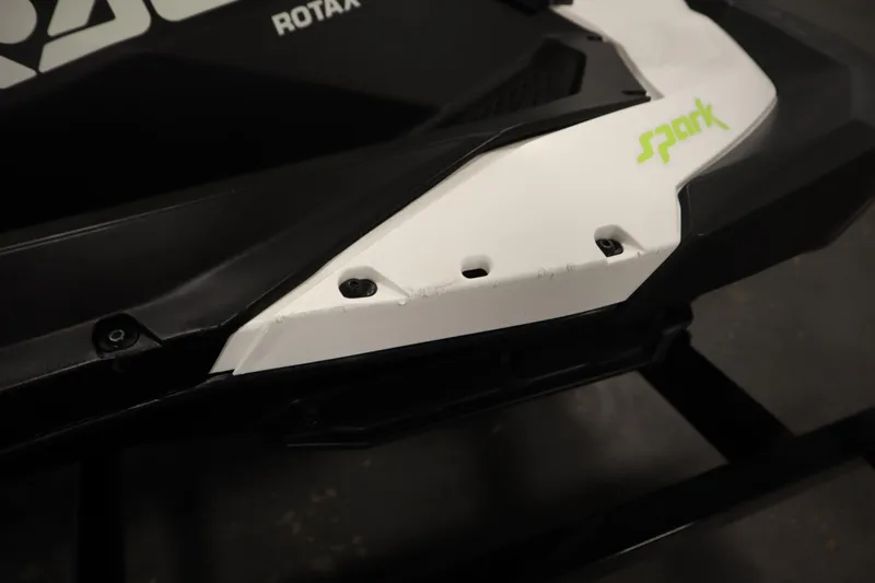 Slide: The Image of 2023 Sea-Doo Spark 3up on trailer, close-up view of hull and step. - 26