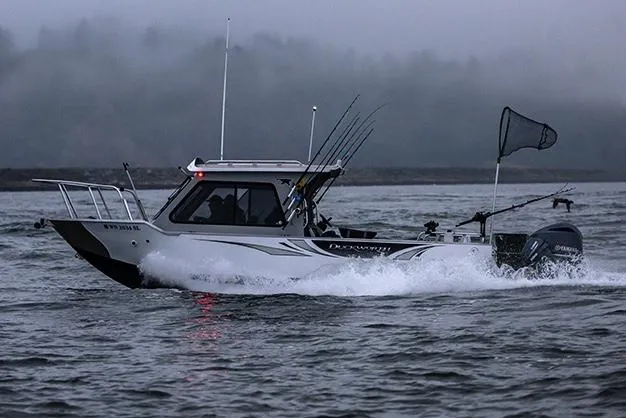 Slide: The Image of 2026 Duckworth 24 Pacific Pro boat on trailer under clear blue sky. - 2