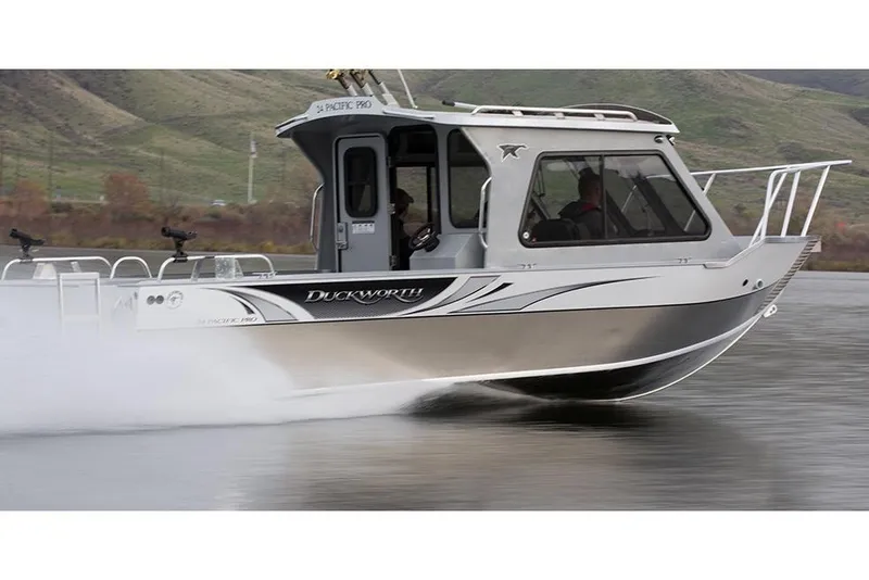 Slide: The Image of Interior of 2026 Duckworth 24 Pacific Pro boat with Garmin navigation system. - 5