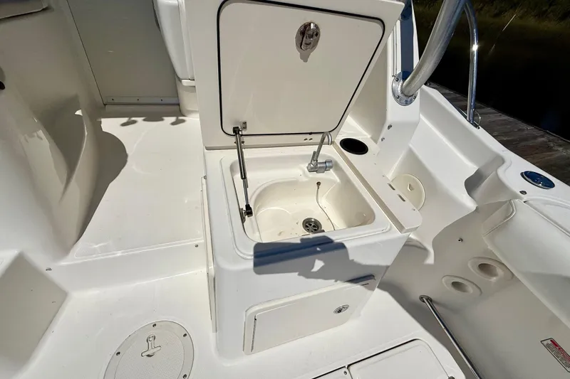 Slide: The Image of 2007 Boston Whaler 285 Conquest boat interior with open storage compartment. - 14