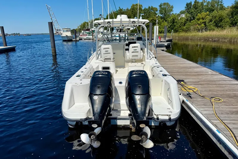Slide: The Image of 2007 Boston Whaler 285 Conquest docked, featuring dual 300 horsepower engines. - 5