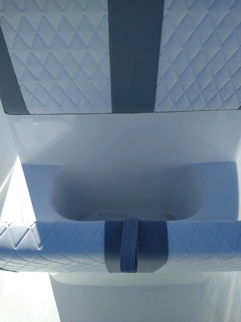 Slide: The Image of 2024 Lookout Skiff 23CC boat seat with diamond-patterned upholstery. - 7