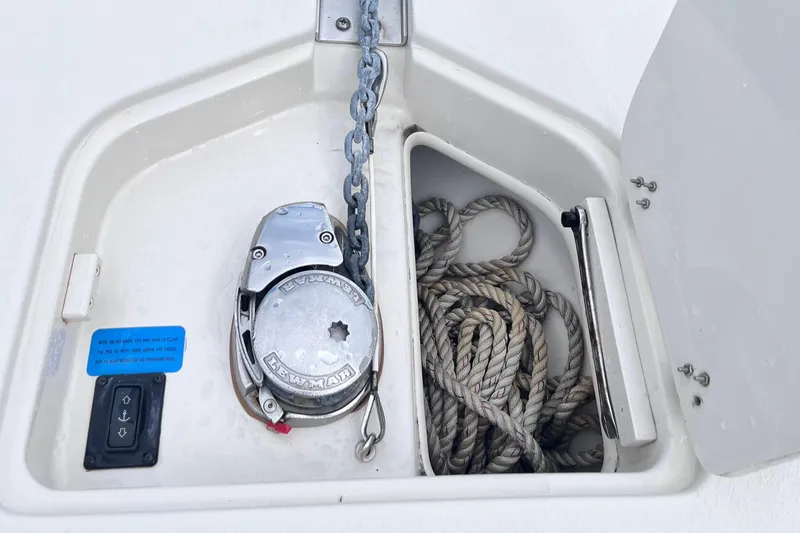 Slide: The Image of Anchor compartment of 2019 Sea Chaser 27 HFC with rope and Lewmar windlass. - 11