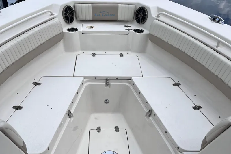 Slide: The Image of 2019 Sea Chaser 27 HFC boat interior with seating and storage compartments. - 12