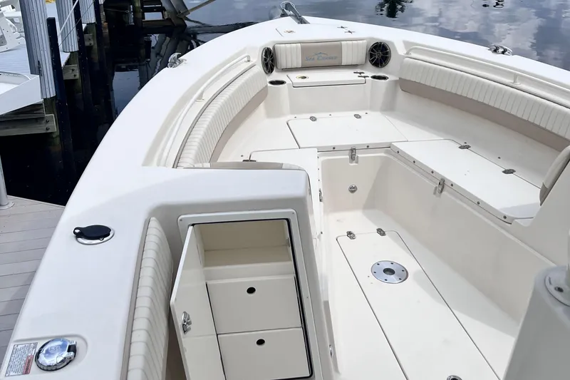 Slide: The Image of 2019 Sea Chaser 27 HFC boat interior with seating and storage compartments. - 13