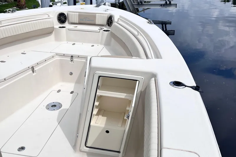 Slide: The Image of 2019 Sea Chaser 27 HFC boat interior with open storage compartment and seating. - 14