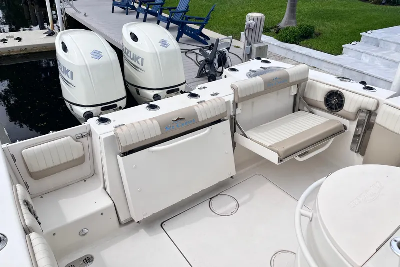 Slide: The Image of 2019 Sea Chaser 27 HFC boat with Suzuki outboard engines at dock. - 18