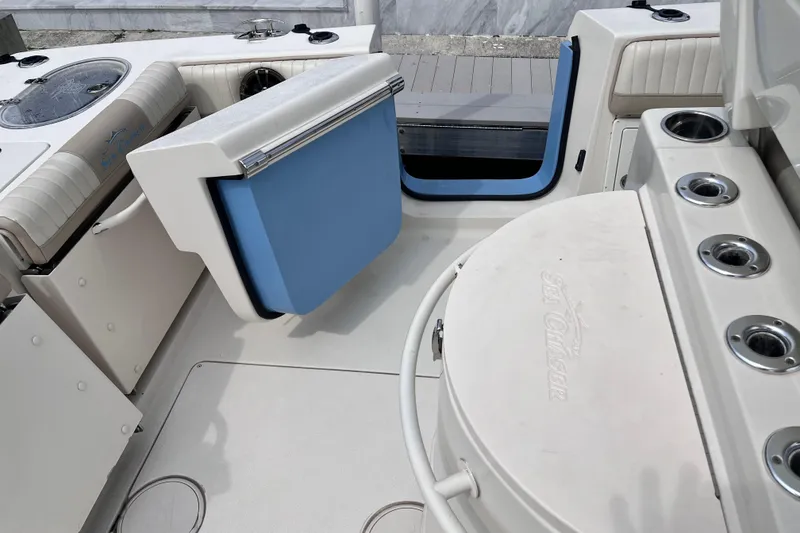 Slide: The Image of 2019 Sea Chaser 27 HFC boat interior with seating and storage compartments. - 19