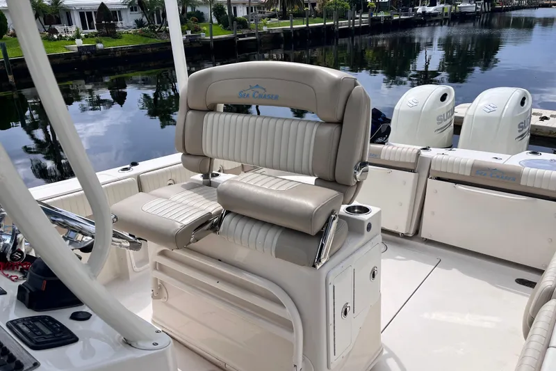 Slide: The Image of 2019 Sea Chaser 27 HFC boat interior with dual seats and Suzuki engines. - 7