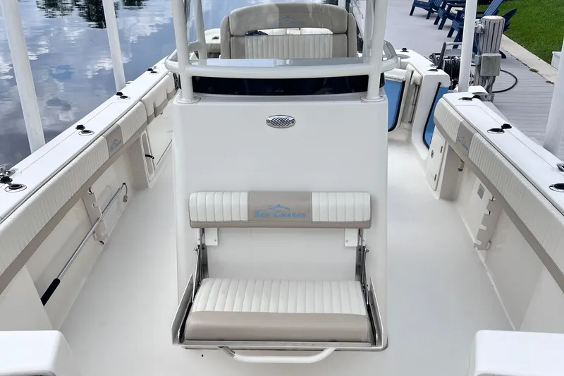 Slide: The Image of 2019 Sea Chaser 27 HFC boat interior with seating and console, dockside view. - 9